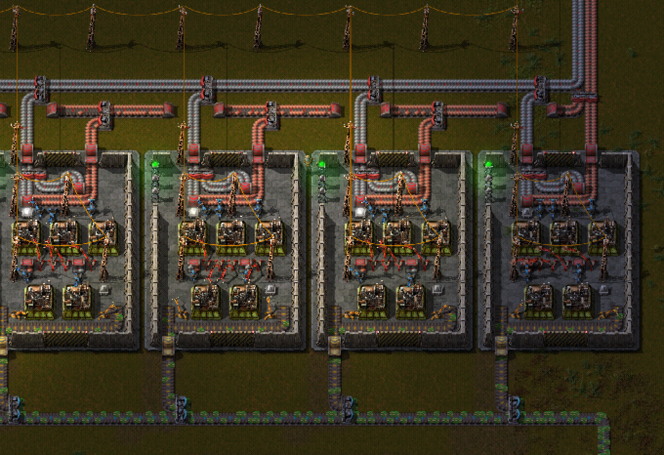 A number of cloned basic-circuit production. Every production-site is surrounded by a fence (here a wall) to prevent accidental changes. The underground belts are the INPUT and OUTPUT. The lights at the side symbolize the OPERATION-MODE. All other clones need to be in the same electric network. You see this example is not perfectly synchronized: The items on the belts are in different positions. Not all lamps are on. This cannot happen, when fully synchronized.